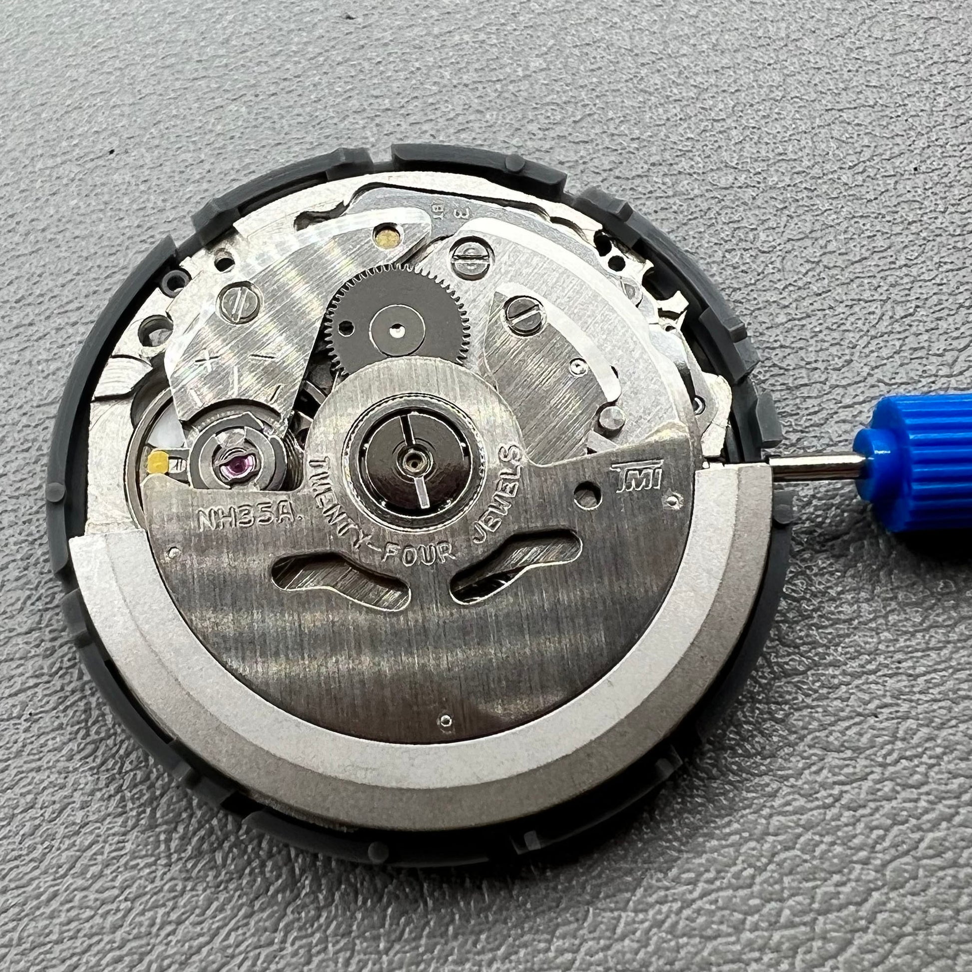 Seiko NH35 automatic watch movement displaying special font details with high accuracy craftsmanship.