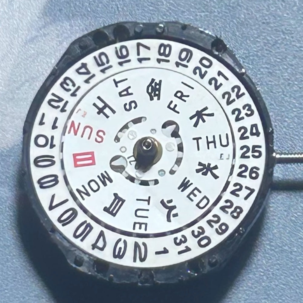 Japan Made TMI PC23A quartz movement with three hands and double calendar disk for watch accessories.