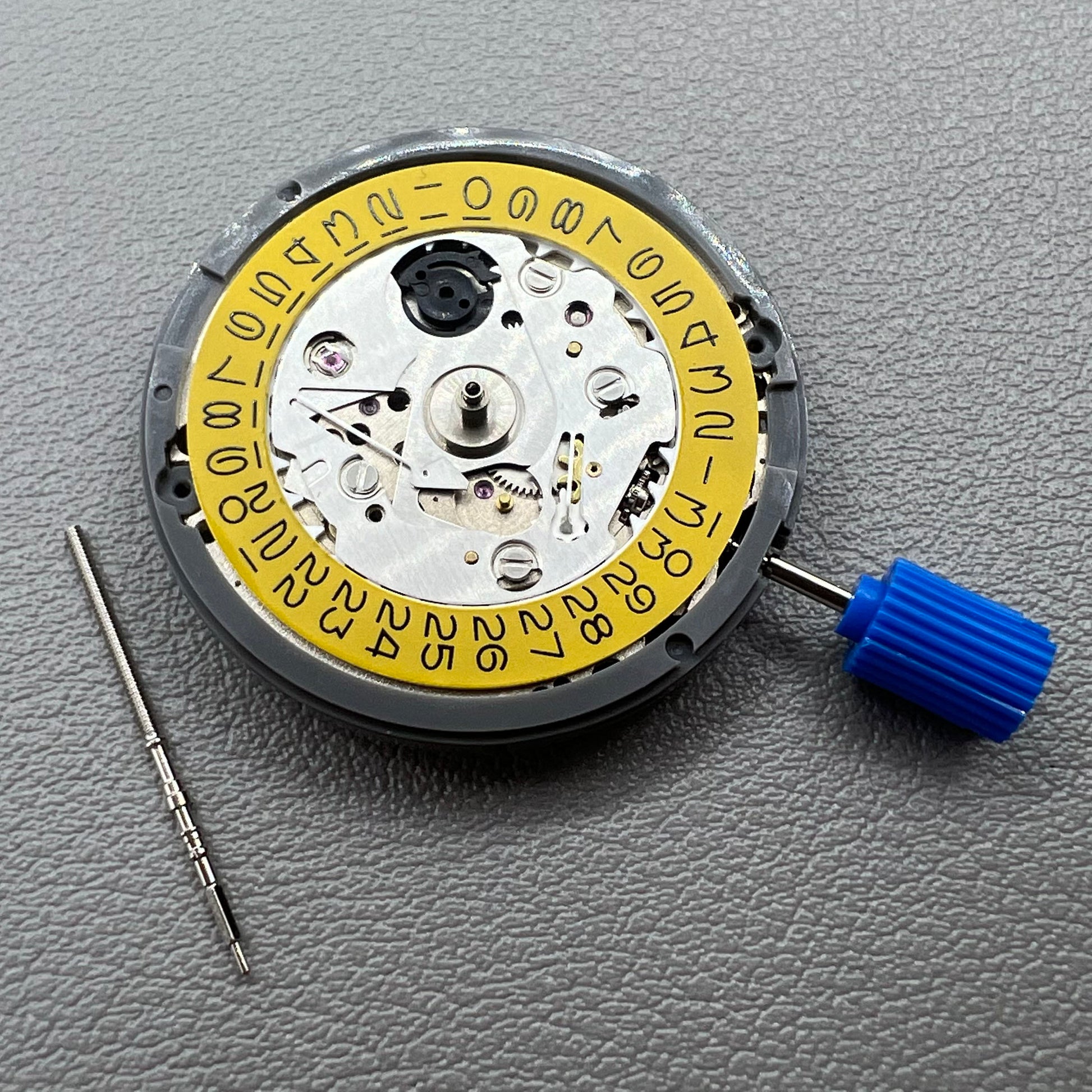 Seiko NH35 automatic watch movement with dark yellow disk, precise mechanical timekeeping by Japan.