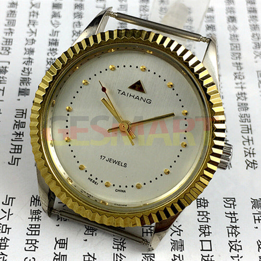 TAIHANG 38mm manual mechanical watch with silver dial, round case, and 3 hands, featuring 17 jewels for precision.
