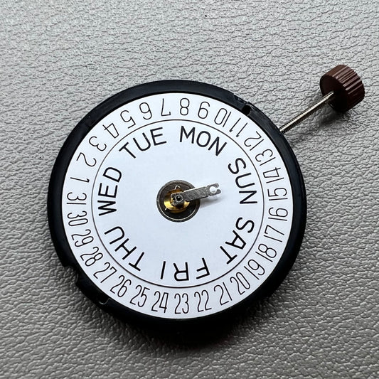 Swiss Ronda 517 quartz watch movement with day and date display at 6 o'clock, precise timekeeping.