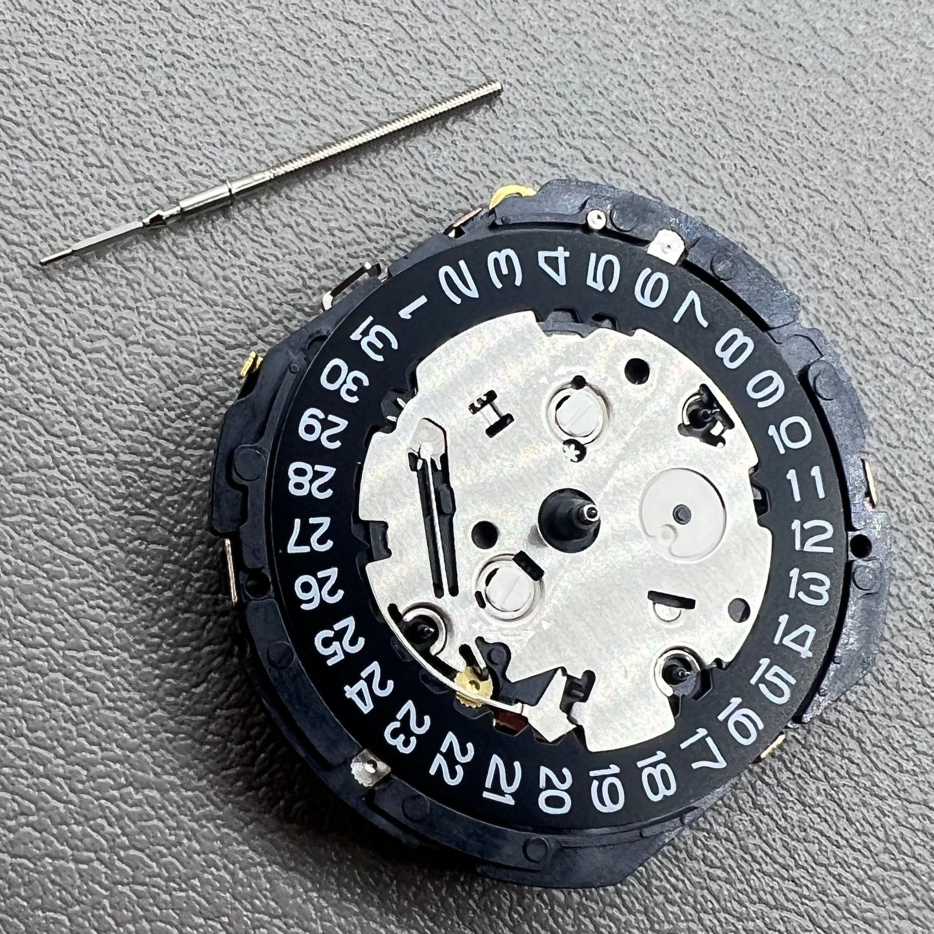Seiko 7T85A quartz watch movement showcasing precision Japan-made craftsmanship for watch accessories.