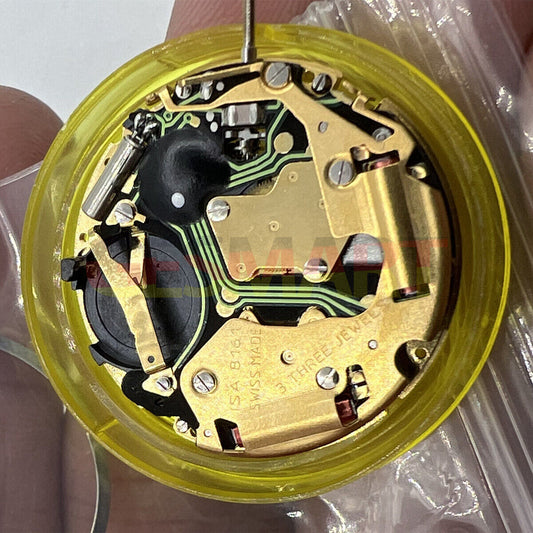 ISA 8161 golden watch part with Swiss quartz movement, 3 hands, for precise timekeeping and repair.