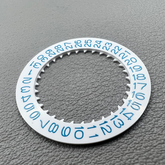 Blue date disk wheel for NH35 watch movement on white background, precise accessory.