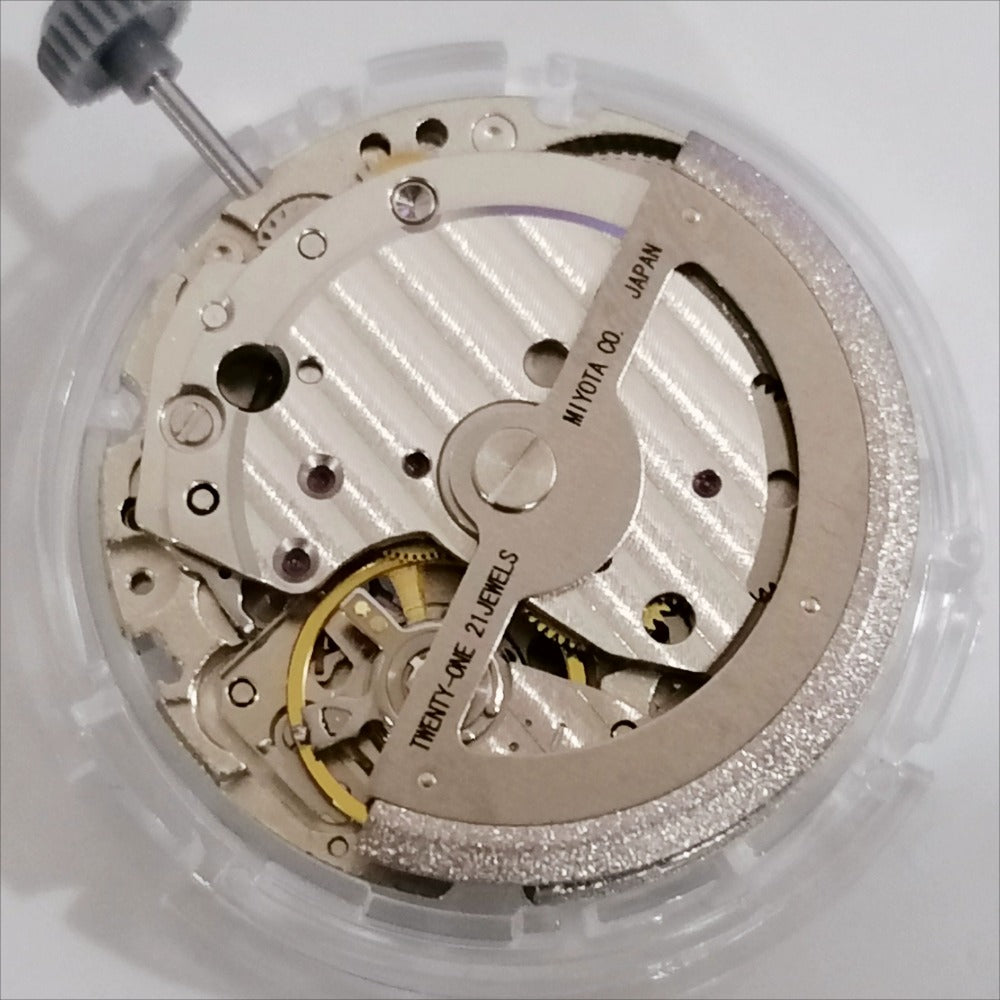 Japan Made Miyota 8217 mechanical watch movement showing small second at 9 o'clock and date at 3, precise craftsmanship.