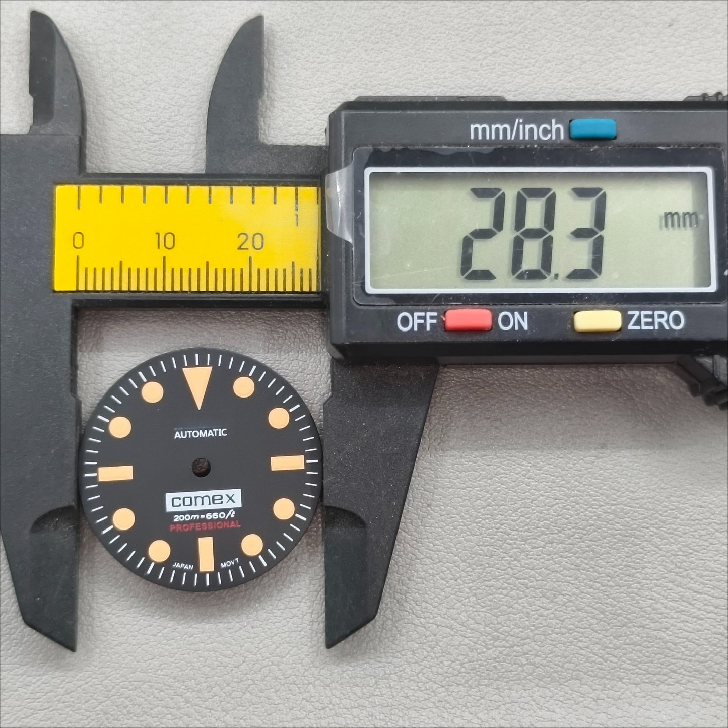 watch dial with S logo