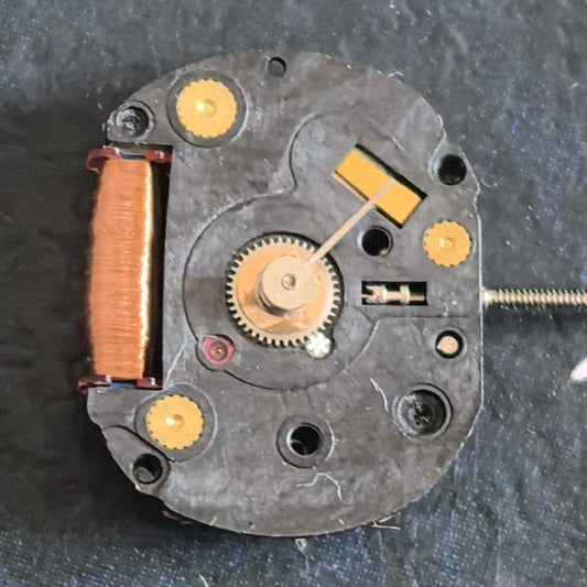 Orient Japan H2501 quartz watch part showing disassembled 3 hands movement for repair and replacement.