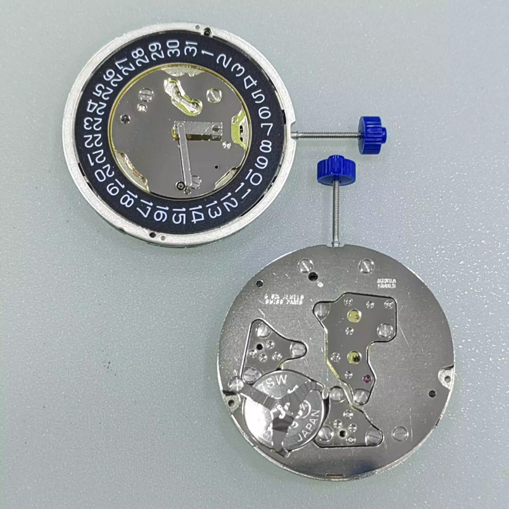 Swiss Part Ronda 5040.D quartz watch movement with date at 3, black disk, precision timing accessory.