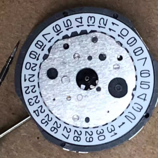 Original Japan Made FS20 quartz watch movement with single calendar date at 3 o'clock, white disk.