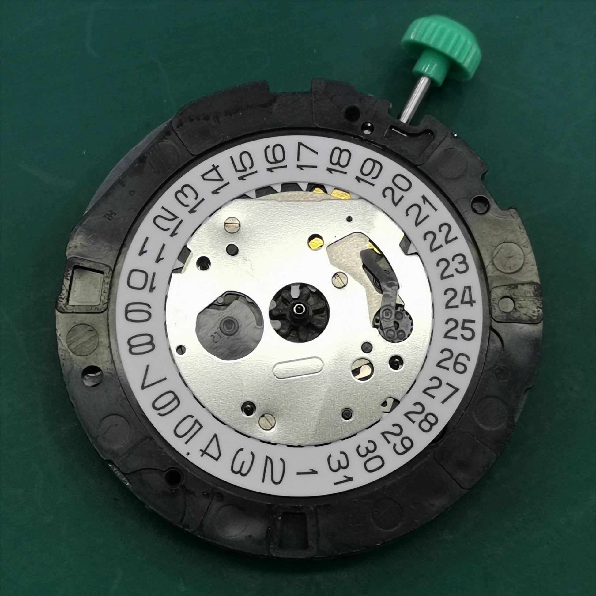 Japan-made Miyota OS20 quartz watch movement with date display at 4:30, ideal for watchmaker repairs.
