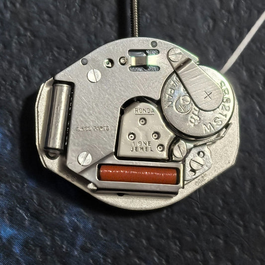 Precise Swiss Part Ronda 763 quartz movement with 3 hands, no calendar, ideal for watch repairs.