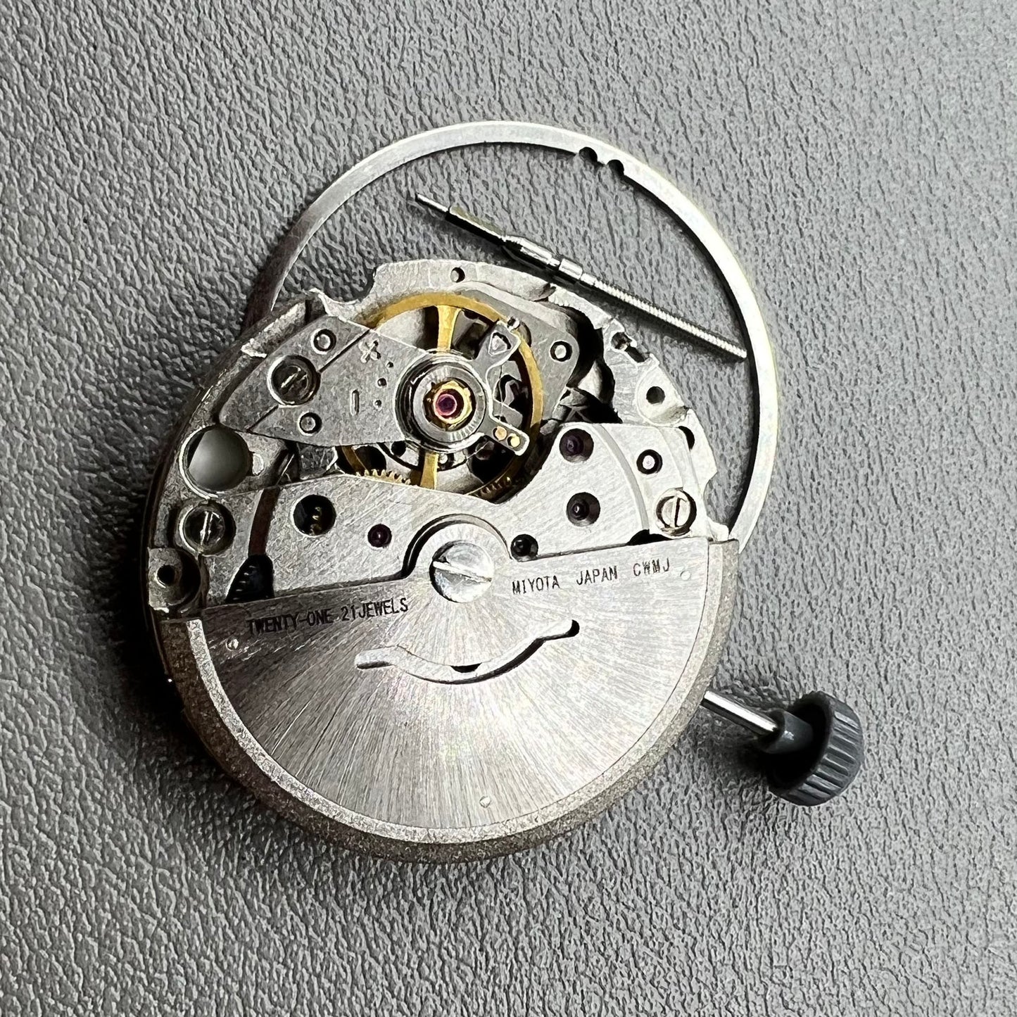 Close-up of Japan Miyota 8200 movement with single date display at 3 o'clock on watch accessory.