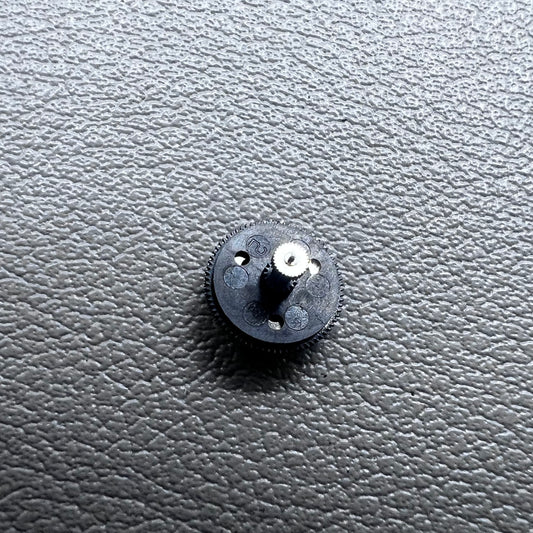 Black counting wheel for ETA C01.211 watch movement, precision replacement part for watch repair.
