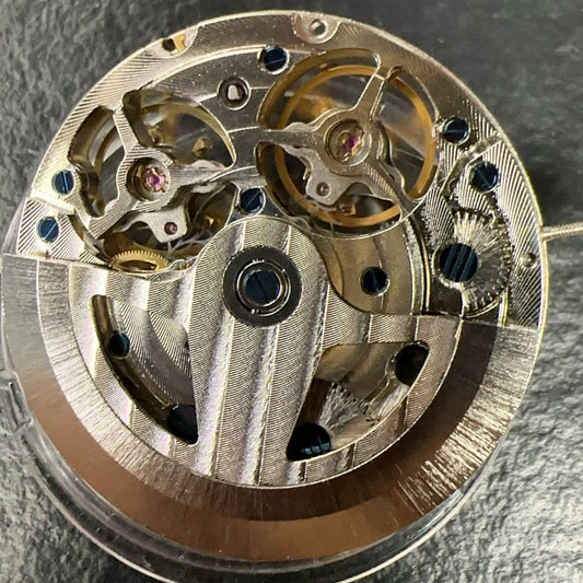 Chinese JH4033 Shanghai watch accessory showing multifunctional mechanical movement with hollow double balance wheel design