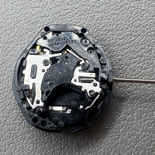 Japan PC23A Quartz watch movement showing 3 hands and double calendar functionality for precise timekeeping.