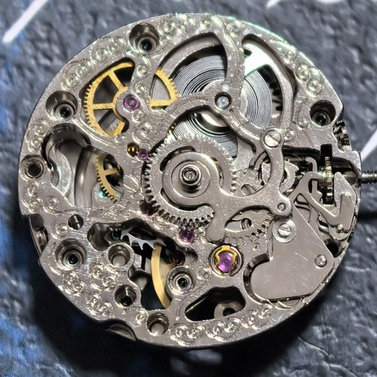 Silver hollow mechanical watch part with silver rotor, precision movement for China-made watches.