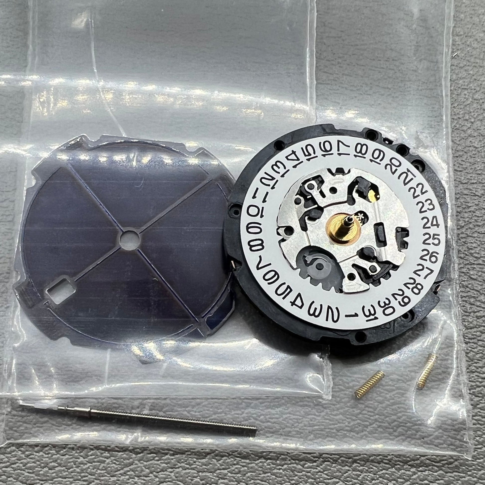 Seiko V187 quartz watch movement showcasing precision timekeeping components.