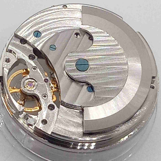 China made silver watch accessory featuring mechanical movement, moonphase at 12 o'clock, and large flywheel design.