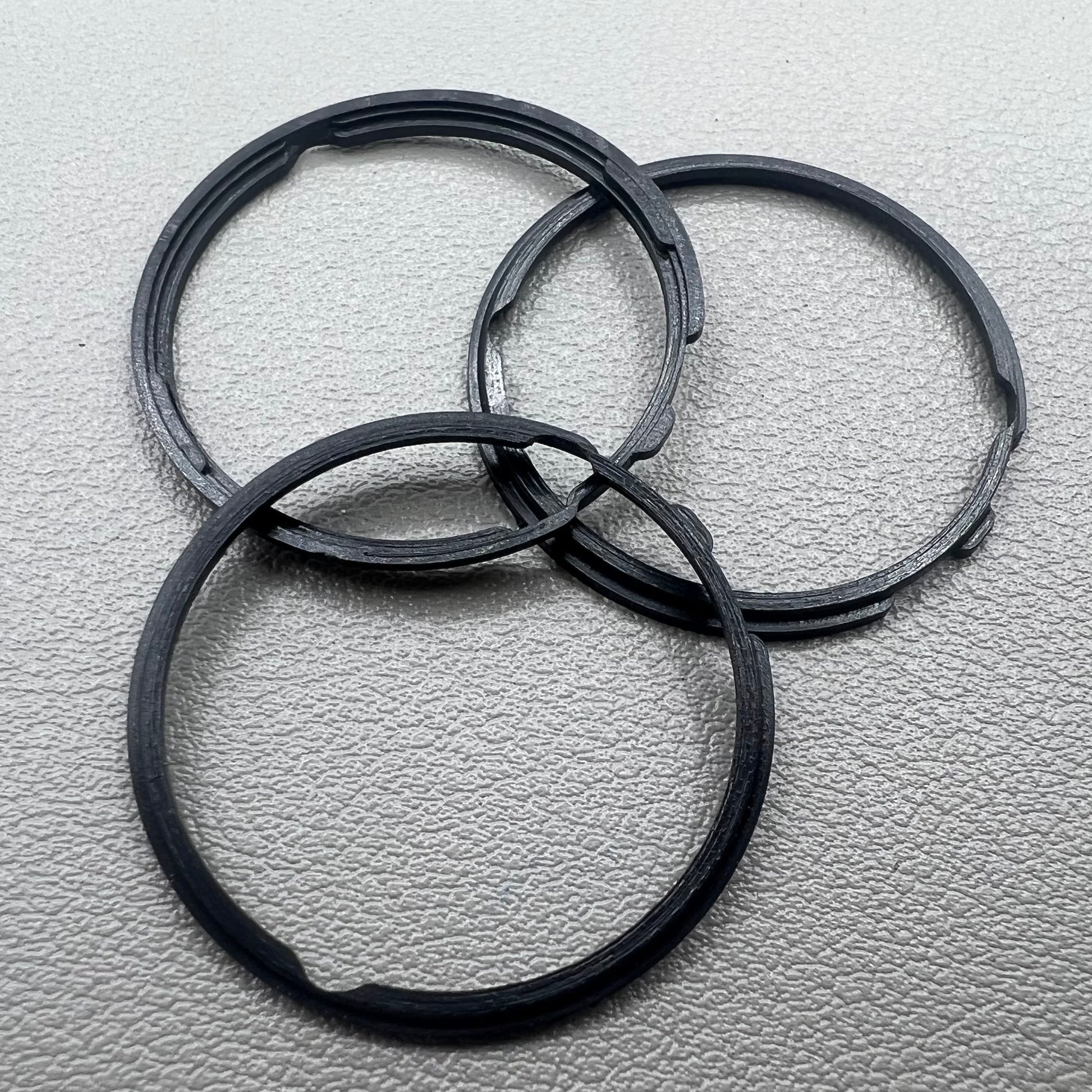 Set of 5 black cushion mount spacer rings by Orient for 46941 watch movement adjustment