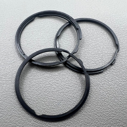 Set of 5 black cushion mount spacer rings by Orient for 46941 watch movement adjustment