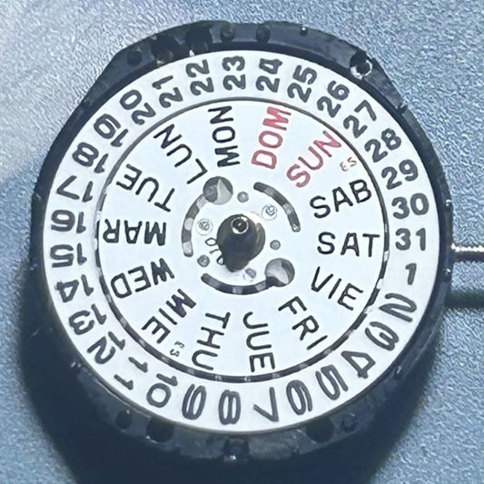 Japan Made TMI PC23A quartz watch movement with 3 hands and double calendar English disk for accurate timekeeping.