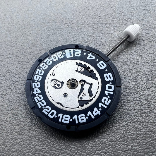 Swiss ISA 2330 quartz watch movement with black font date at 6 o'clock, precise 3-hand accessory.