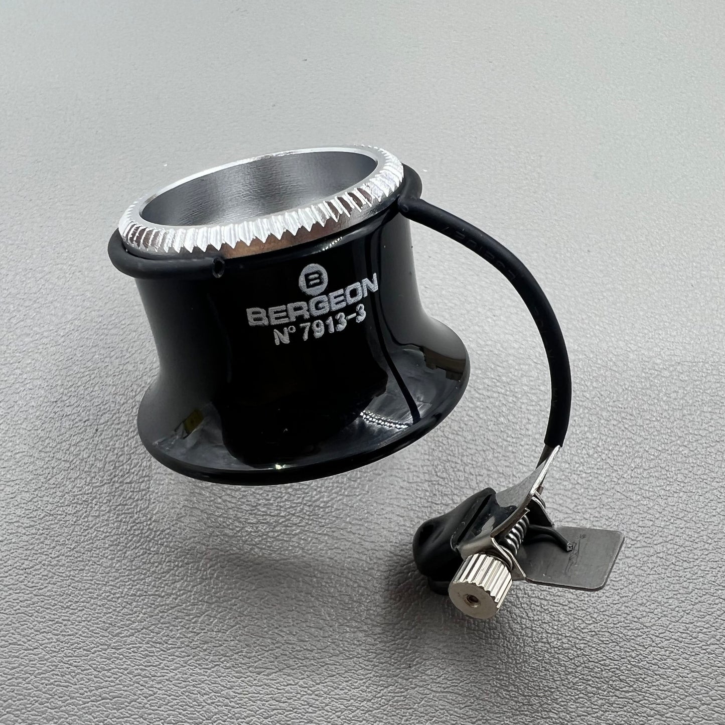 Swiss Bergeon 7913 3.3x magnifying eyeglass clip for precise watch accessory repairs and adjustments.