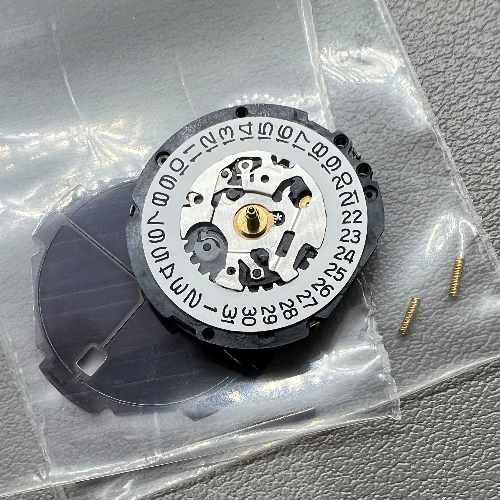 Seiko V187 quartz watch movement showcasing precision timekeeping components.