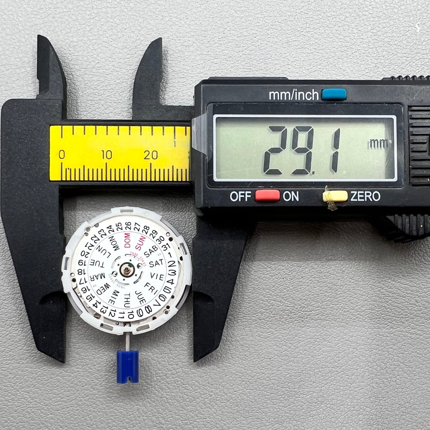 Japan Epson YN56 mechanical watch movement showing date and day functions.