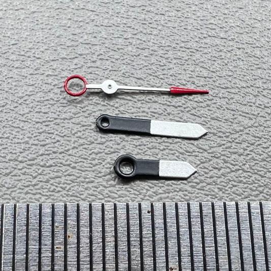 Set of black and white painted trim arrow-shaped watch hands without lume for Ronda 515, ideal for precise timekeeping.