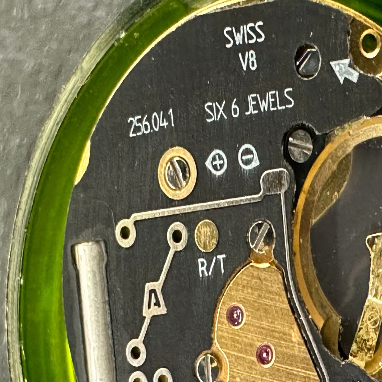 Swiss Made ETA256.041 quartz watch movement with black dial, date at 6, perfect for repairs and replacements.