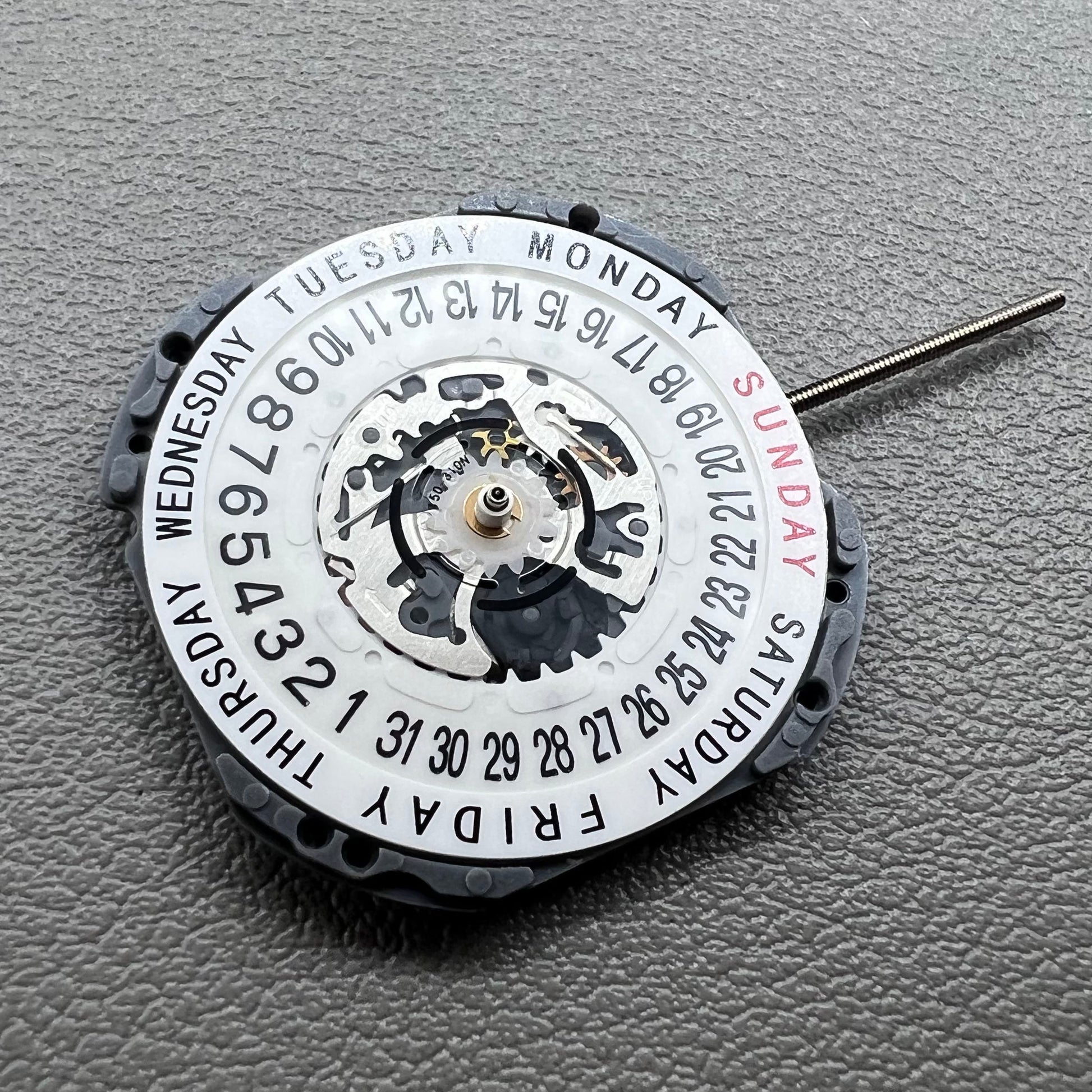 Japan Hattori Epson VJ45B quartz watch movement with date at 6 o'clock and day at 12 position.