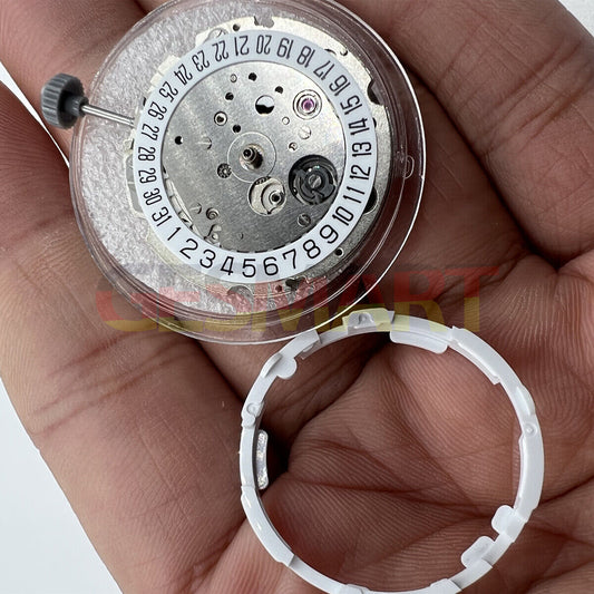 Miyota/Citizen 8215 silver plated watch movement with date at 6, Japanese automatic mechanical precision.
