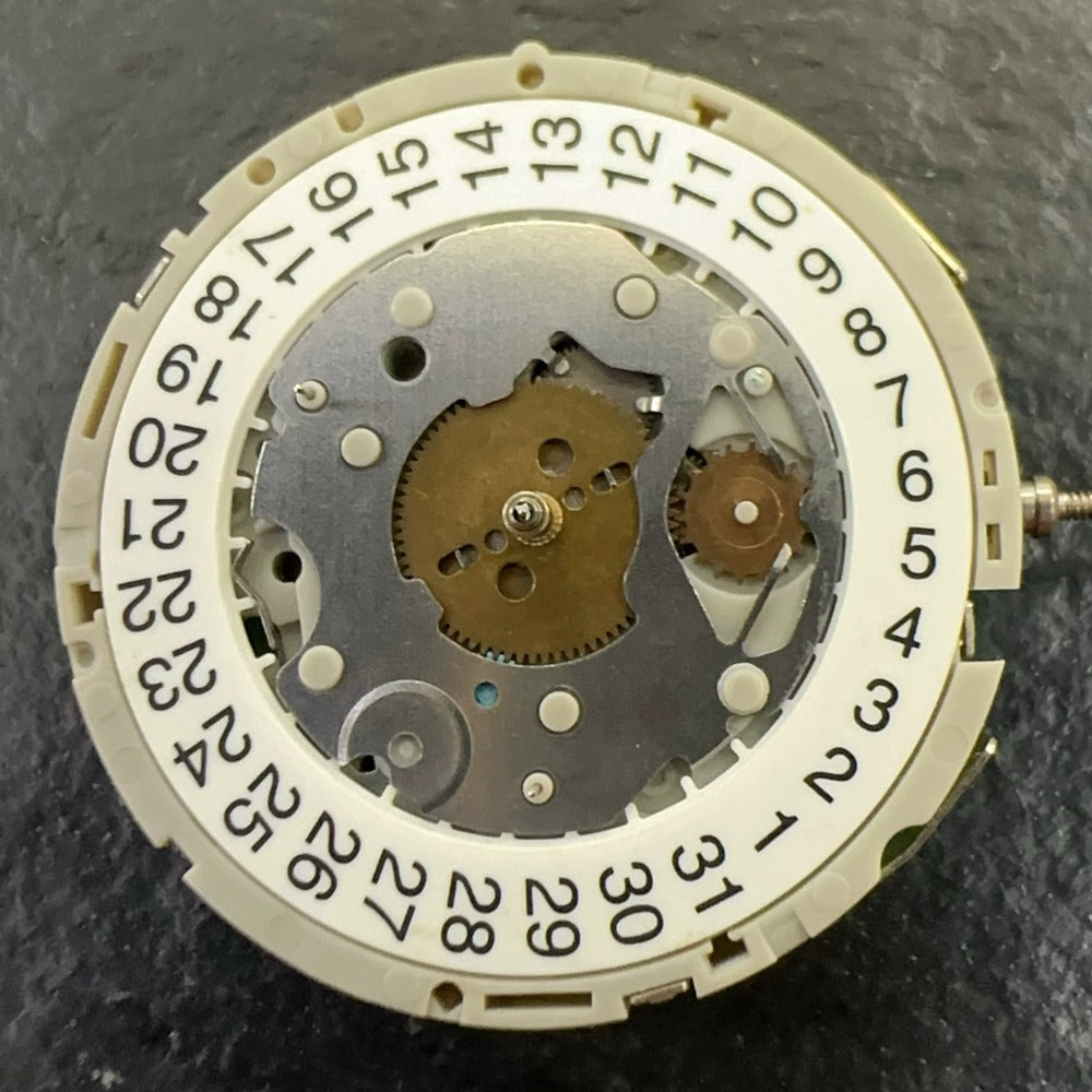 Original M921 watch part showing multifunctional movement with small seconds at 2, 6, and 10 o'clock positions.