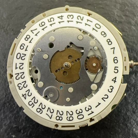 Original M921 watch part showing multifunctional movement with small seconds at 2, 6, and 10 positions.