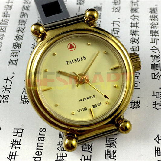 TAISHAN 27mm manual mechanical lady watch with 19 jewels, golden case, and yellow dial for elegant style.
