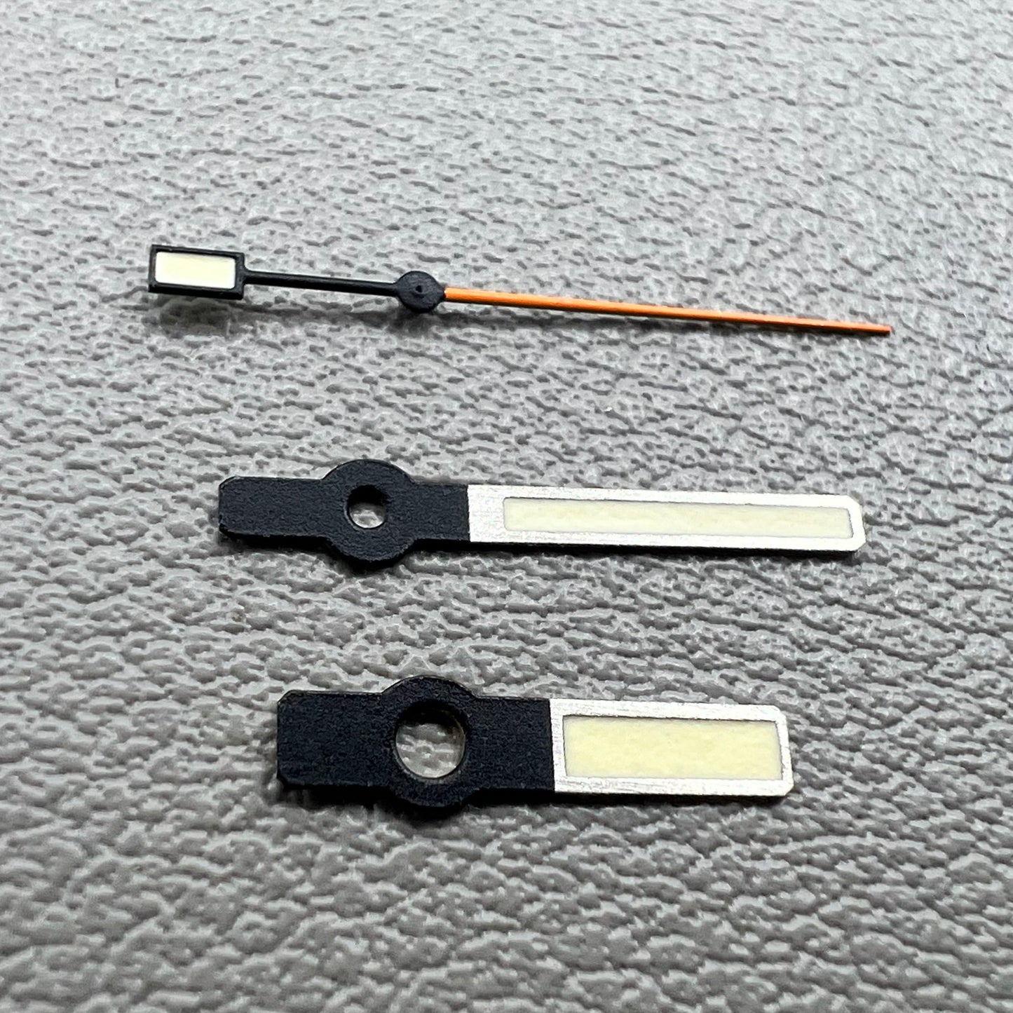 Set of green luminous orange second hands with silver trim for NH35/NH36/4R/7S watches.