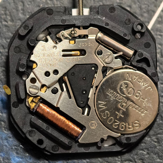 Epson VX33 quartz watch part with day-date English disk, Japan made, for precise timekeeping and repair.