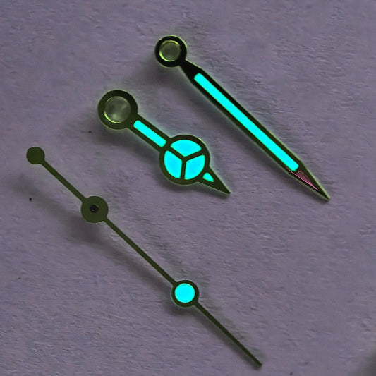 Modified vintage golden trim watch hands set with blue/green lume for 3135 movement, enhancing style and readability.
