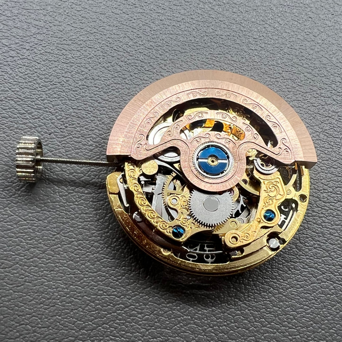 Hangzhou 2189 golden hollow watch movement showcasing intricate mechanical single calendar design.