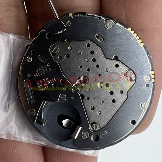 Miyota 6S20 quartz movement watch dial with date at 3, three hands, and small seconds at 3, 6, and 9 positions.