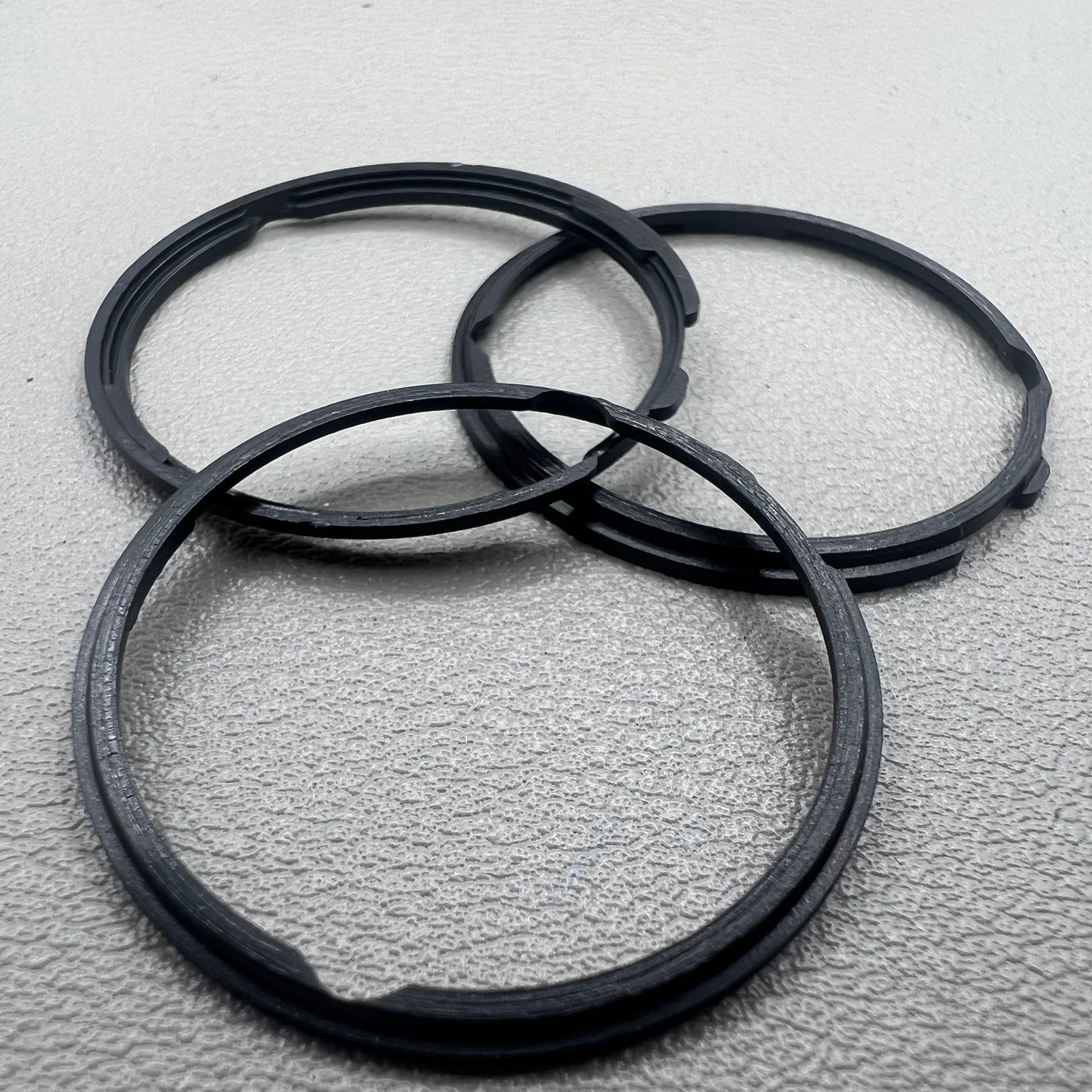 Set of 5 black cushion mount spacer rings by Orient for 46941 watch movement adjustment