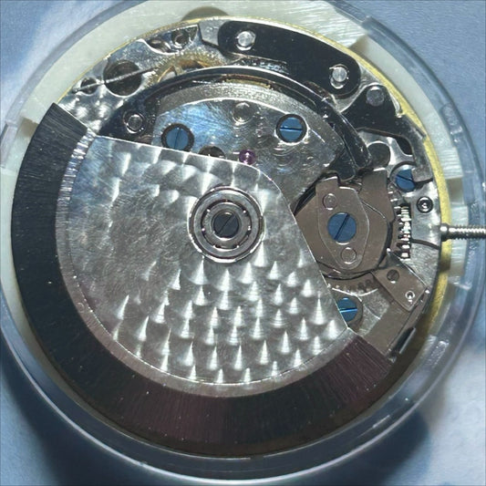 Dandong 7750 mechanical watch movement with small seconds at 6, 9, 12 and date at 3 features.