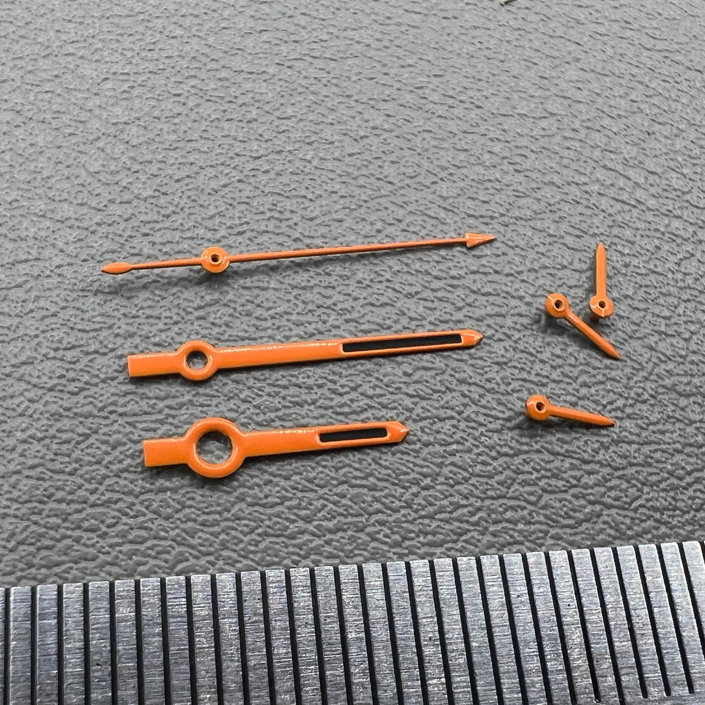 Orange-trimmed black watch hands with green lume, compatible with VK63 movement, perfect for precise timekeeping.