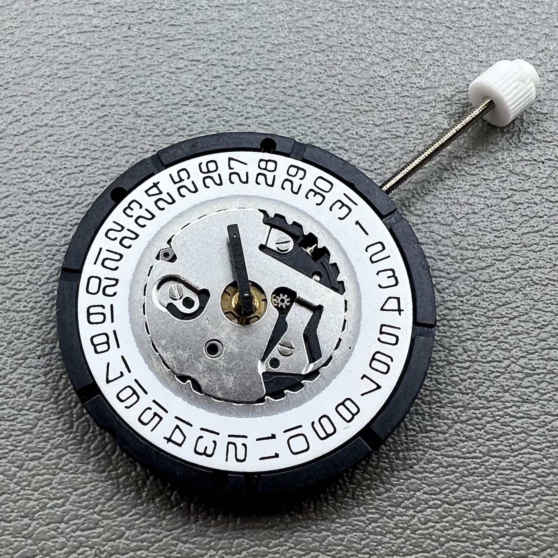 Swiss ISA 2320 watch accessory with white dial, quartz movement, date display at 3 o'clock by Swiss brand.