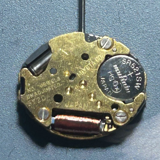 Japan-made 5Y20 quartz watch movement with 2 hands, disassembled for precise timepiece repairs.