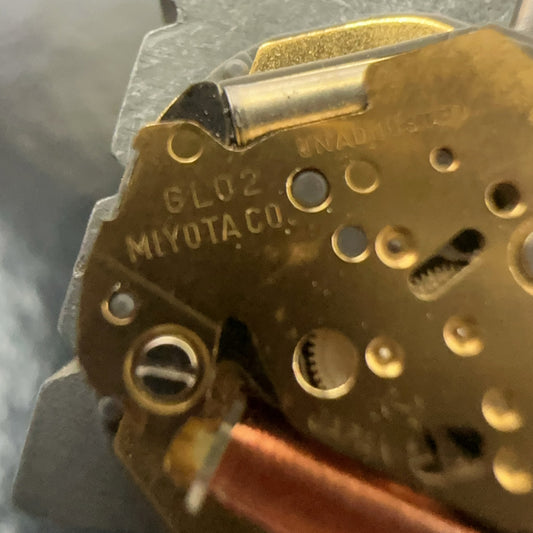 Japan-made Miyota 6L02 quartz watch movement with double calendar, 3 hands, and date display at 6 o'clock.