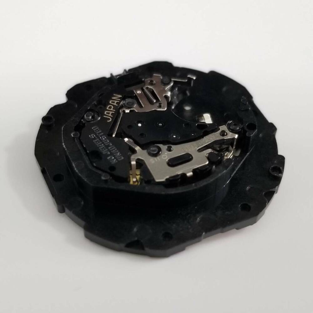 Hattori Epson TMI PC33 quartz watch movement, precision Japan-made replacement for watch repairs.