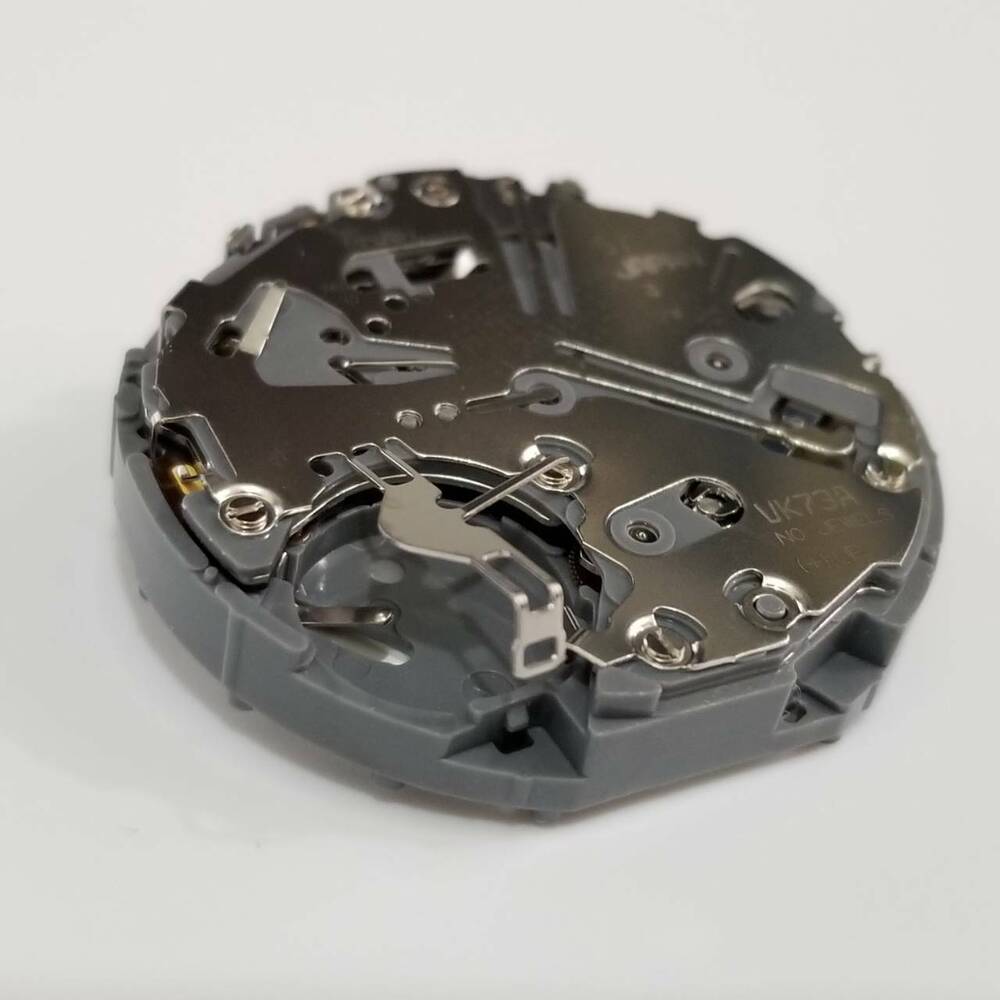 Hattori Epson TMI VK73 quartz watch movement replacement part for accurate timekeeping.