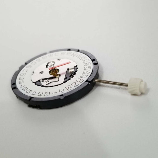 Close-up of ISA 2320 quartz movement watch repair parts for precise timepiece maintenance.